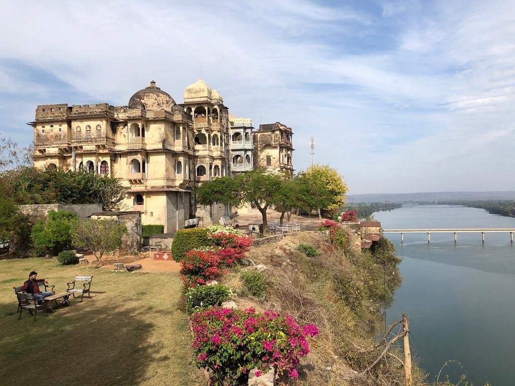 Historic Rajasthani fort walls rising above the water